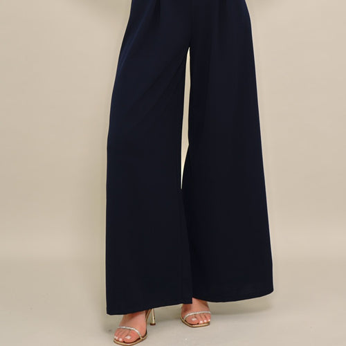 Navy wide-leg pants on a neutral background