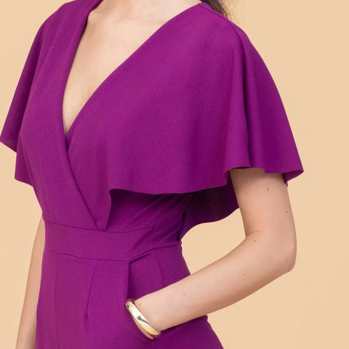 Purple dress with a deep neckline on a beige background